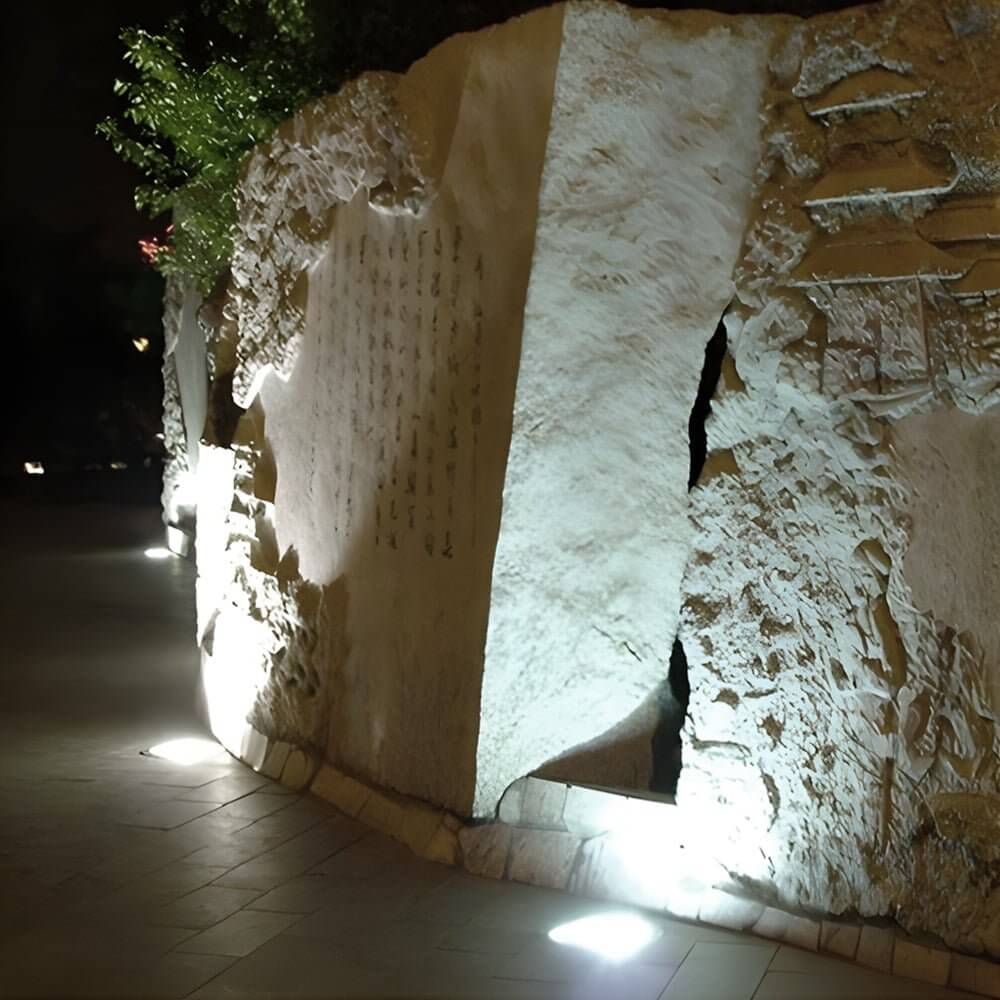 Recessed floor lighting installed in a modern building entrance for stylish and functional pathway lighting.