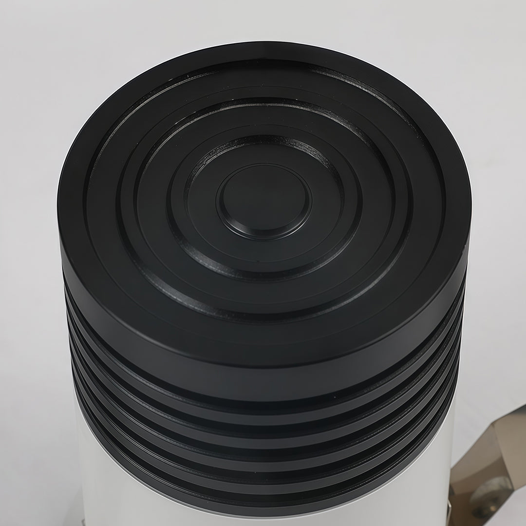 Black heat sink component of recessed LED ceiling light displaying thermal engineering detail.