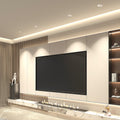 Recessed LED ceiling lights creating layered lighting design in living room entertainment area.