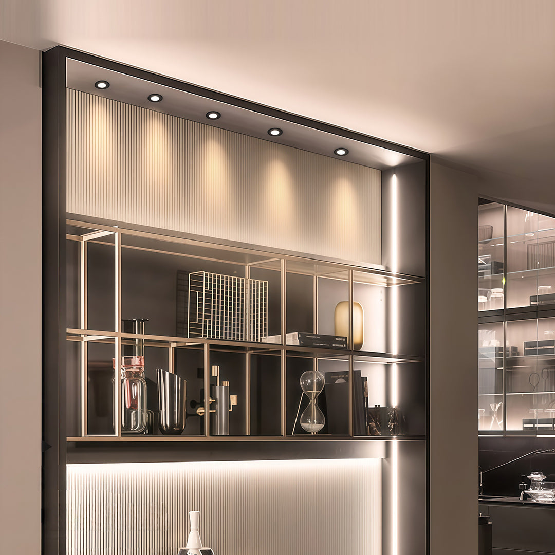 Recessed ceiling spotlights providing ambient illumination in modern luxury bar and dining area.