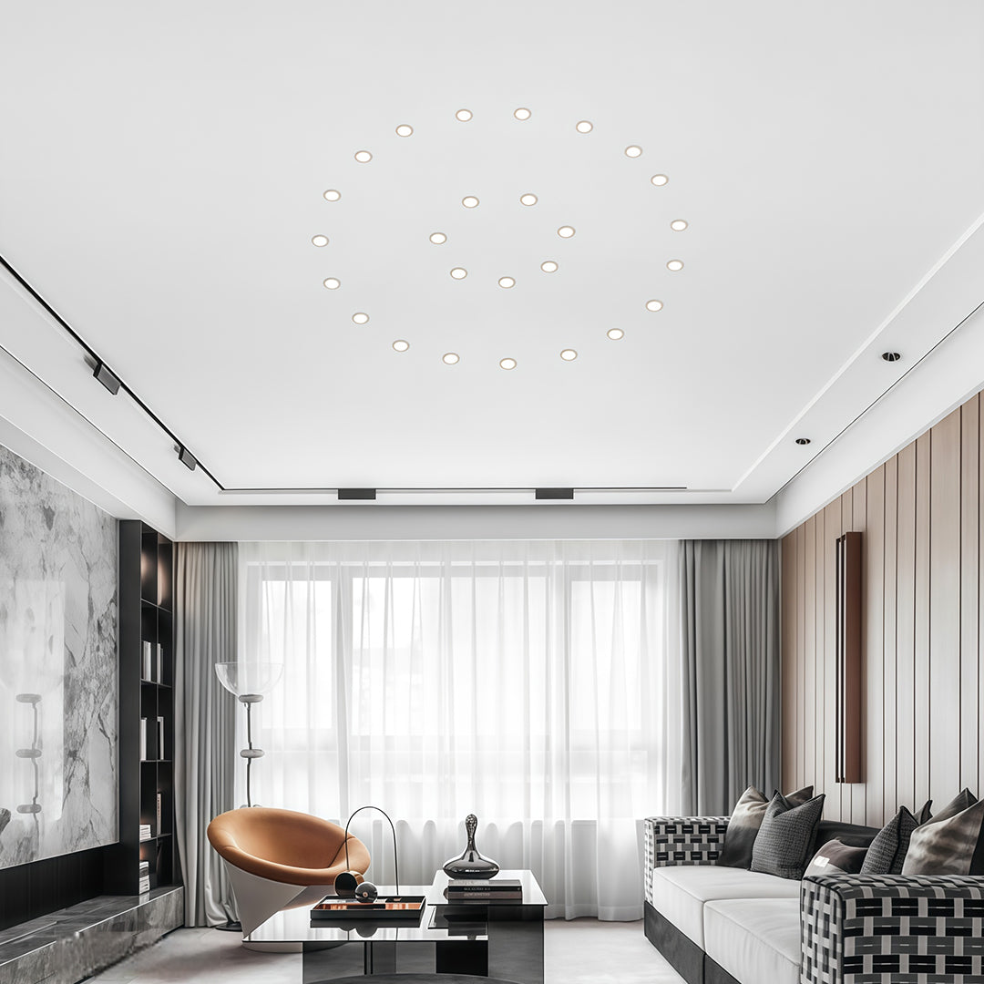 Multiple recessed ceiling spotlights creating layered ambient lighting in elegant living room interior.