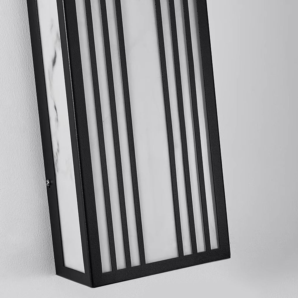 Rectangular exterior wall sconce with a sleek design, enhancing a modern exterior wall.