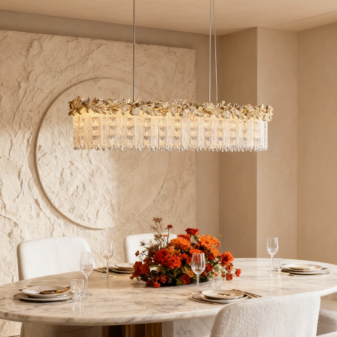 Rectangular gold chandelier crystal in bright modern dining space.