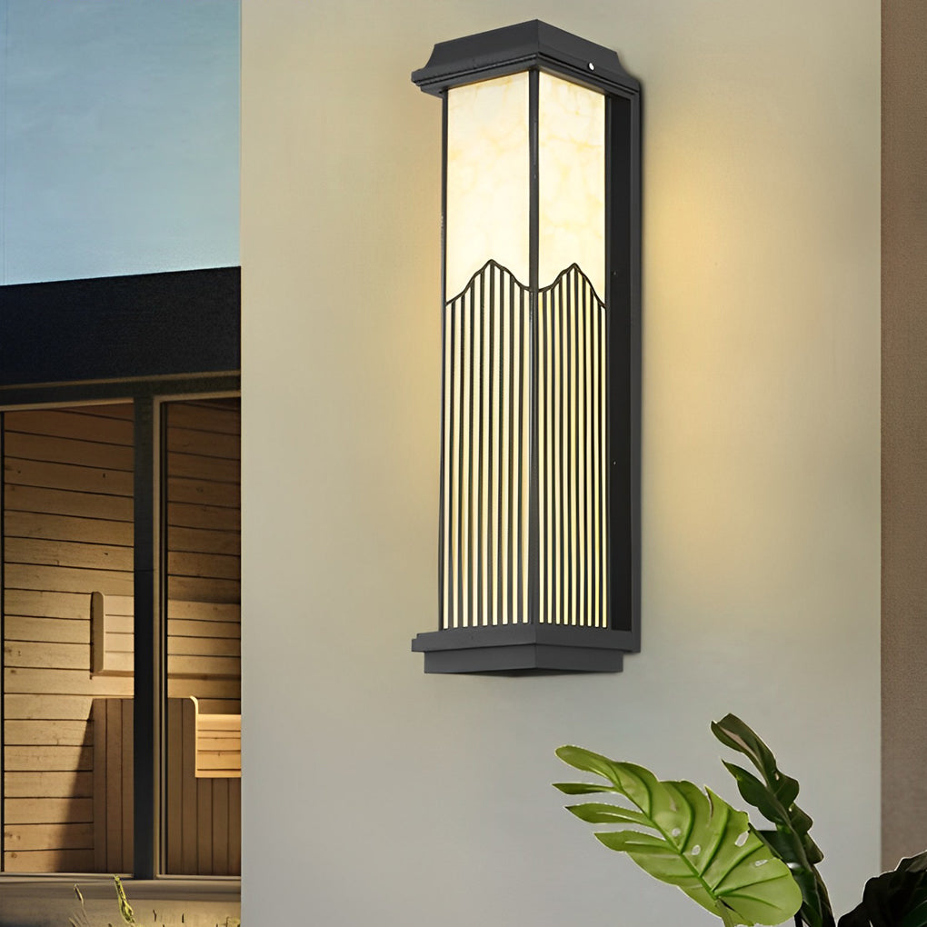 Rectangular outdoor sconce with a close-up of its vertical slats and soft glow.