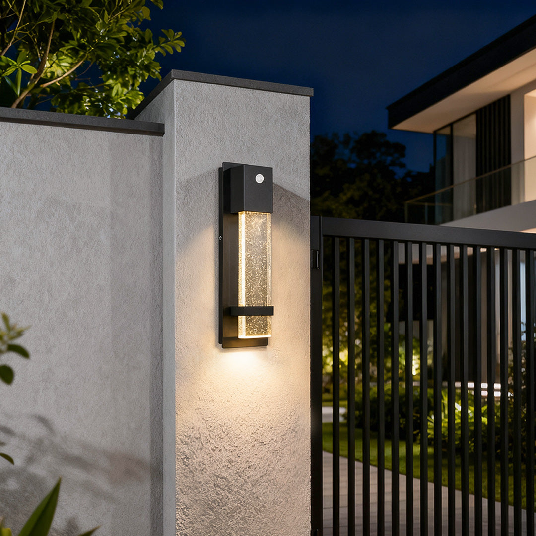 Contemporary rectangular outdoor wall lights installed on exterior wall next to the gate for safety lighting.