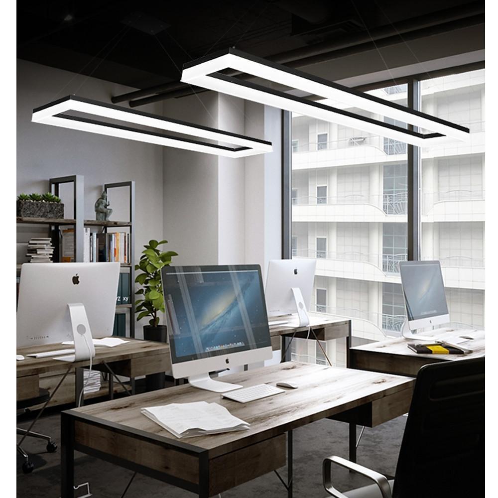 Double rectangular pendant lights suspended in modern office with large windows.