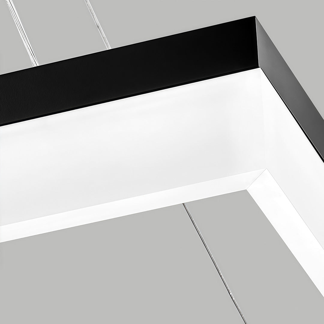 Close-up detail of rectangular pendant light slim frame and LED diffuser.