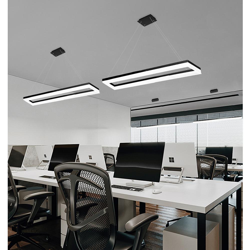 Rectangular pendant light installed in open-plan office above shared desks.