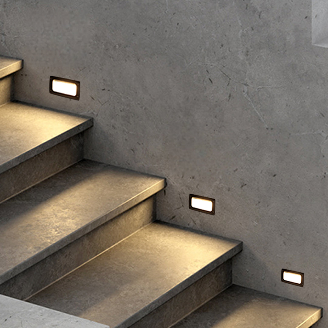 Detailed view of rectangular step light showing black housing with white diffuser panel