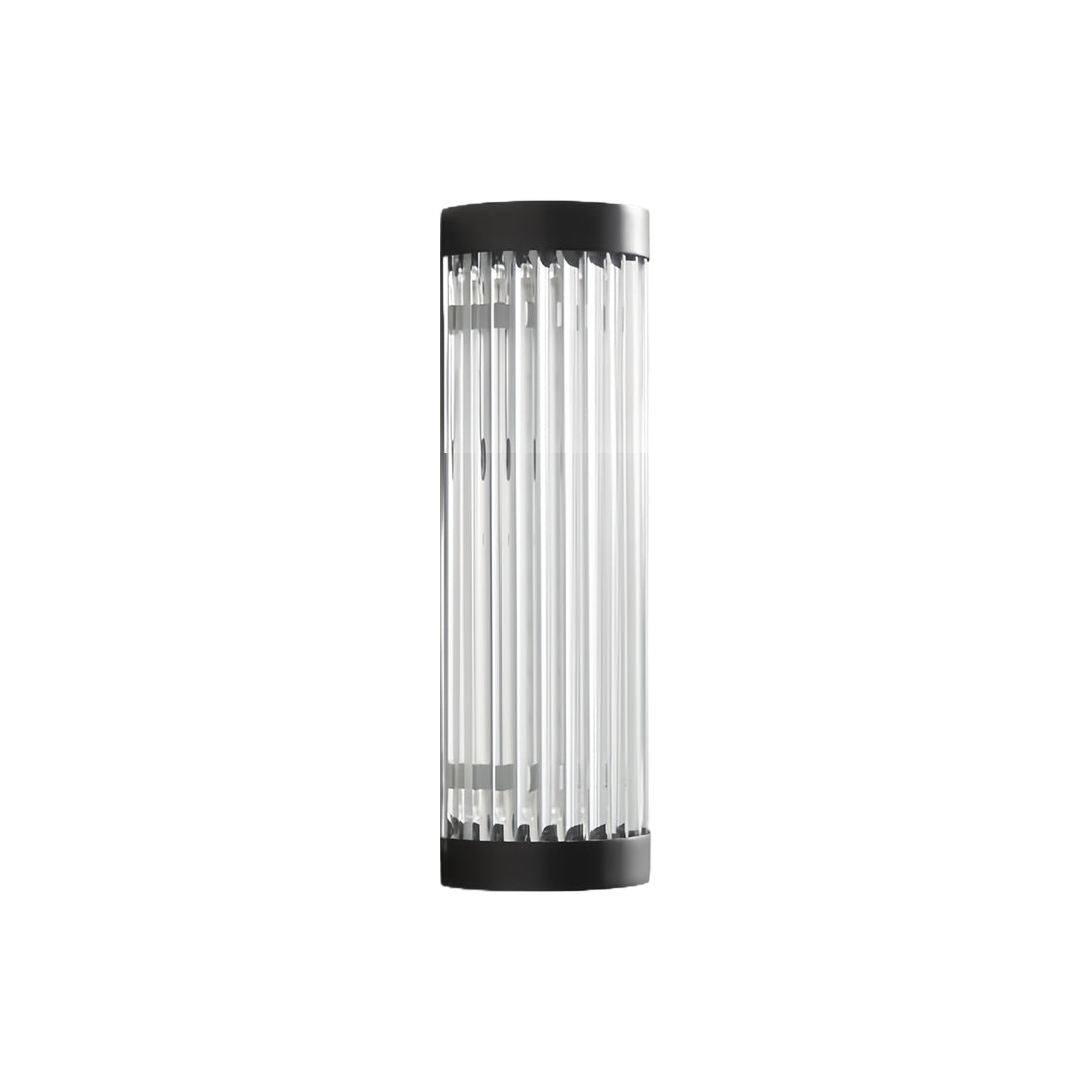 Outdoor wall LED light positioned on a residential patio wall, highlighting a textured surface with bright amber-toned lighting.