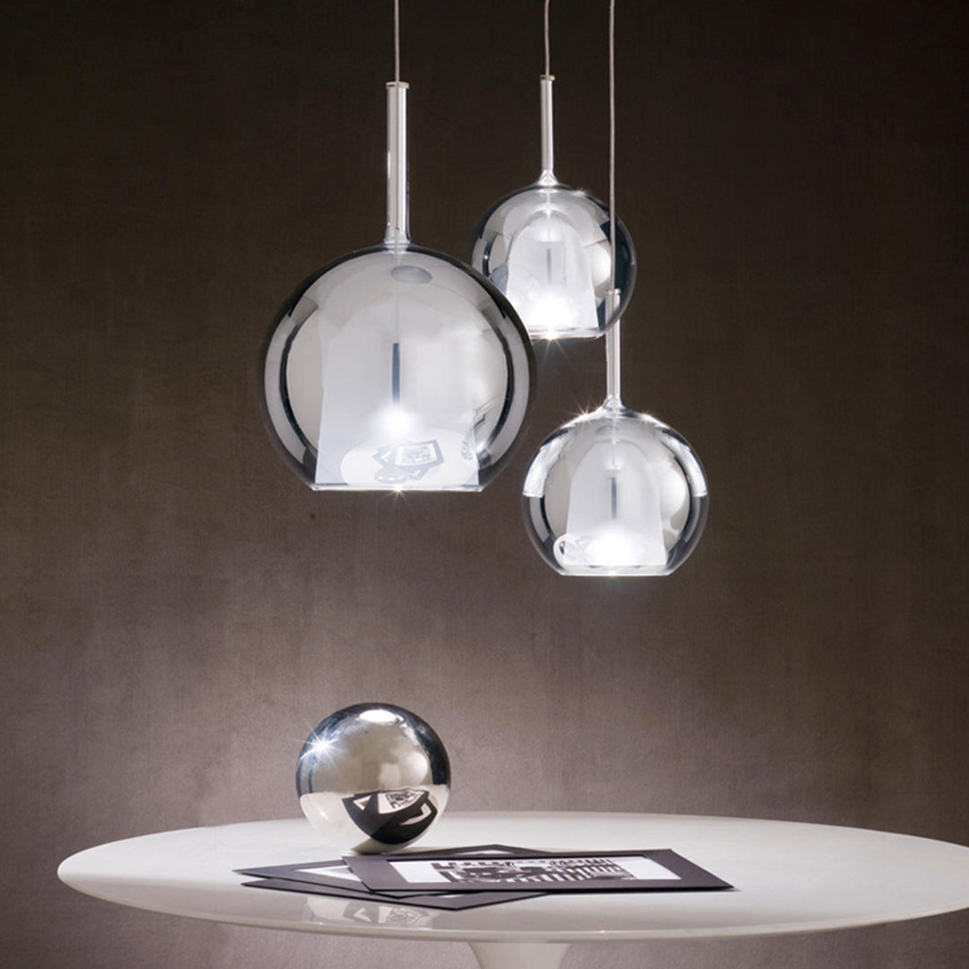 Stylish restaurant interior with dramatic glass ball pendant lights creating sophisticated ambiance
