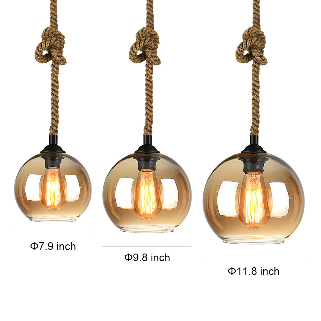 Three retro glass pendant lights with amber globes and rope cord suspension in size comparison.