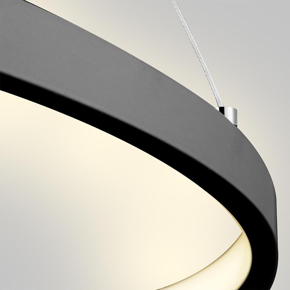 Close up of a black ring chandelier LED detail, highlighting the smooth circular frame and integrated LED light strip.