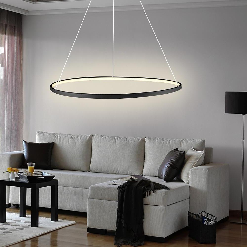 Minimalist ring chandelier LED installed above a sofa in a modern living room, delivering even illumination with a sleek circular design.