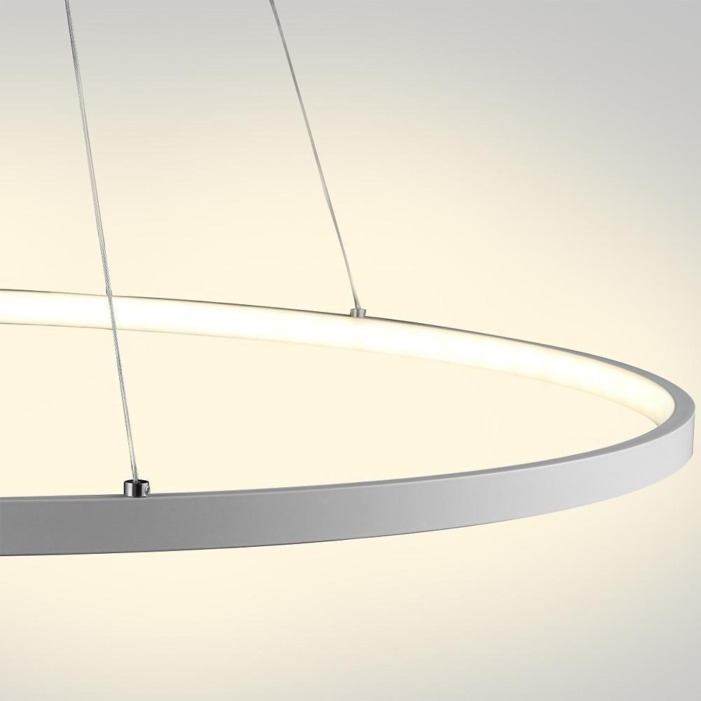 Close up of a white ring chandelier LED suspended by cables, emphasizing the slim ring design and soft diffused lighting.