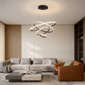 Modern ring LED chandelier installed above living room seating area.