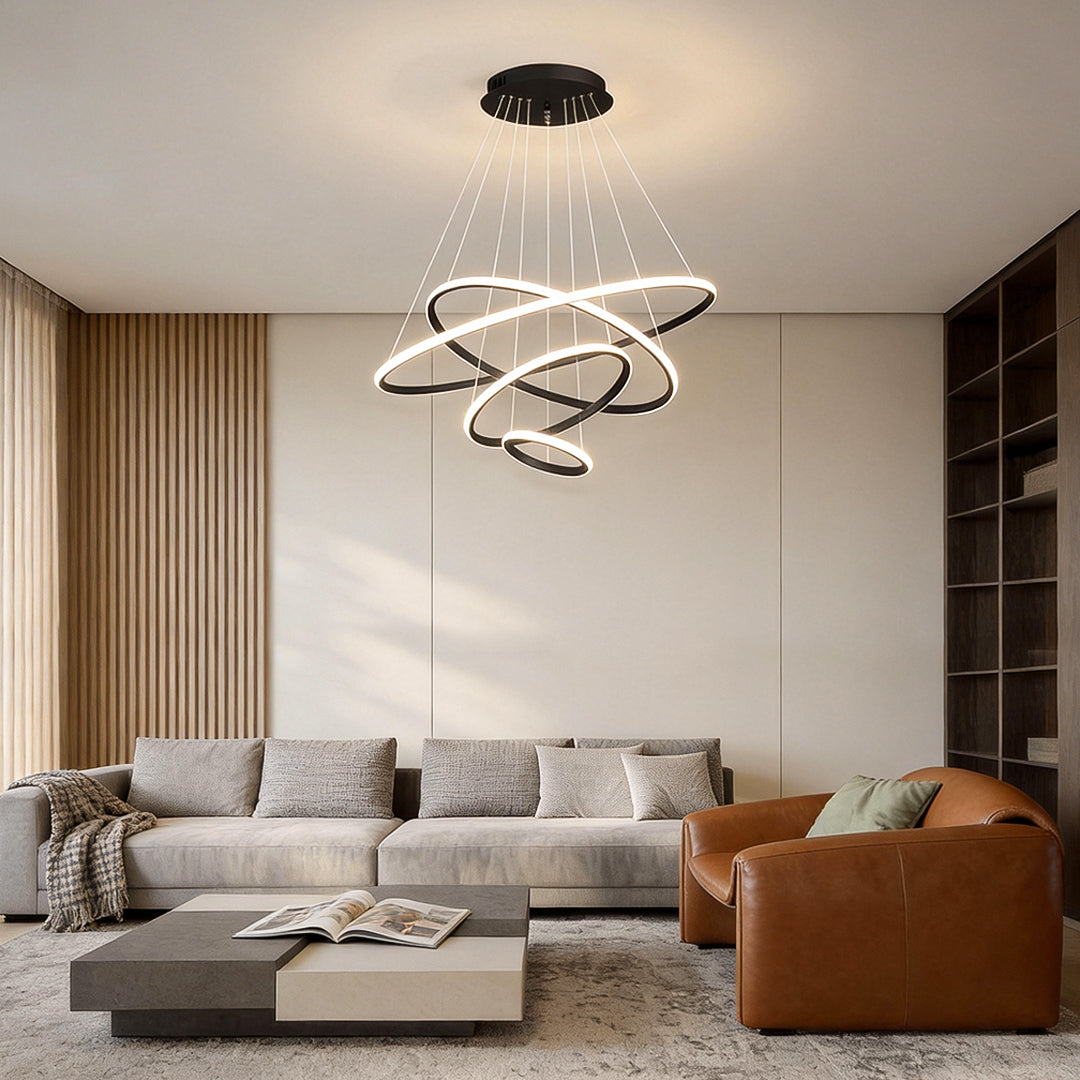 Modern ring LED chandelier installed above living room seating area.