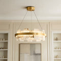 Elegant ring-shaped copper modern chandelier featuring faux alabaster stone panels illuminating an upscale room.