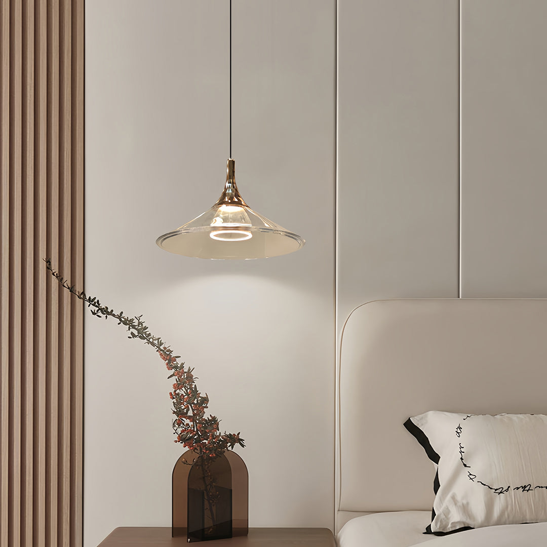 Rise and fall pendant lights with cream shade complementing minimalist aesthetic with dried botanicals