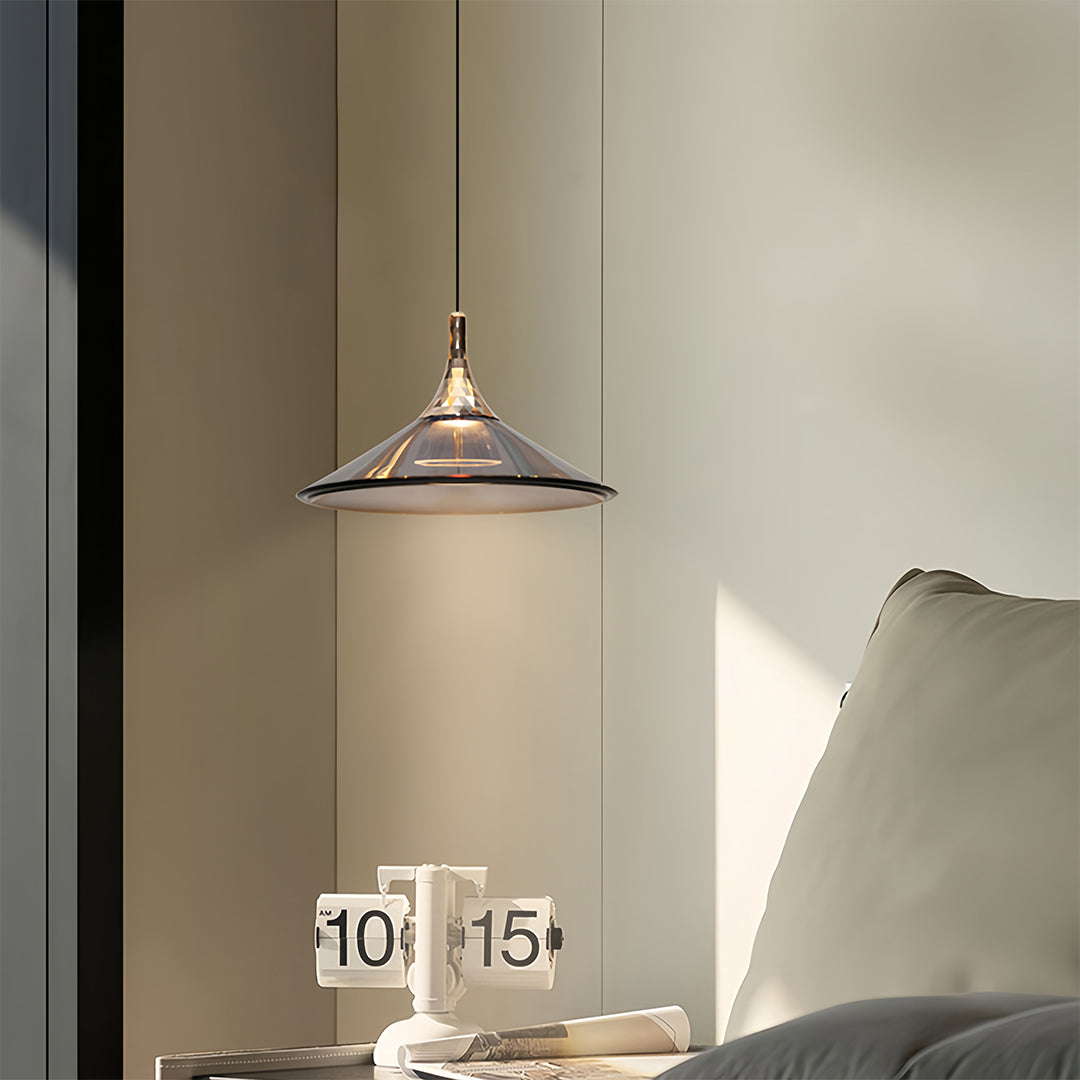 Rise and fall pendant lights with vintage glass shade illuminating modern minimalist dining area
