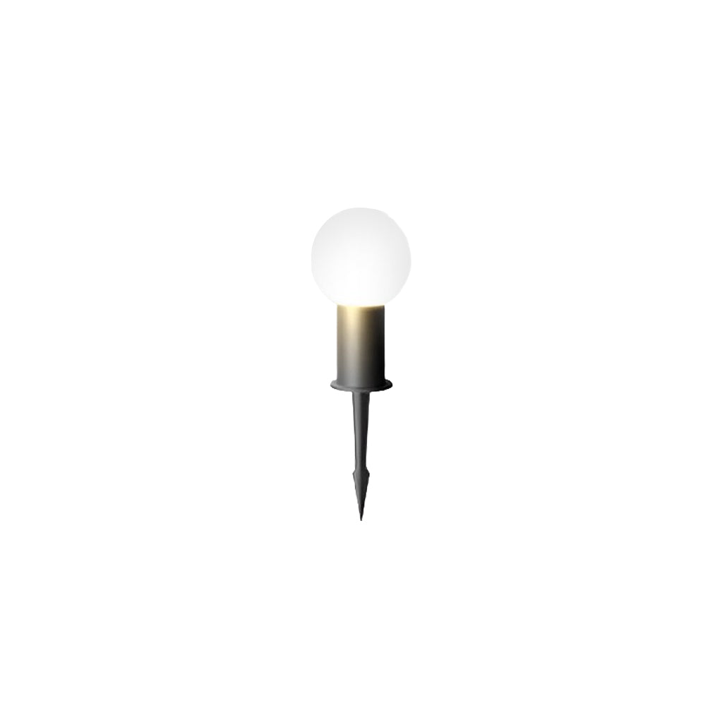 Round bollard lights with a black finish, providing warm light near a pathway.