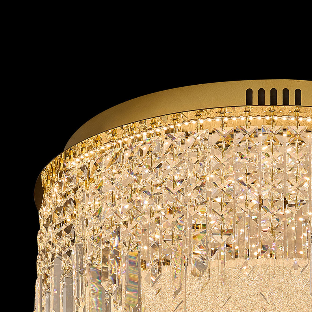 Close-up of round crystal ceiling lights flush mount with gold rim.