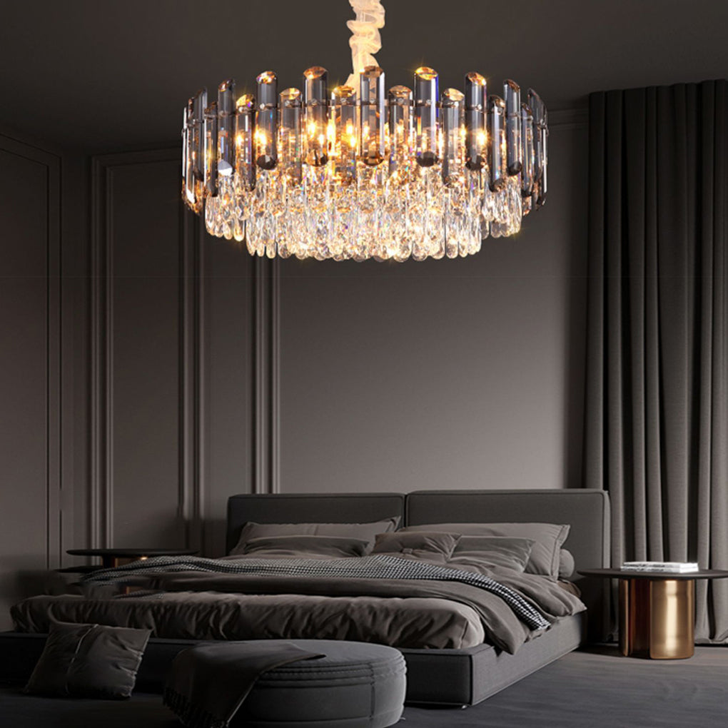 Round drum crystal chandelier hanging above a bed, adding a touch of glamour to a luxurious bedroom.