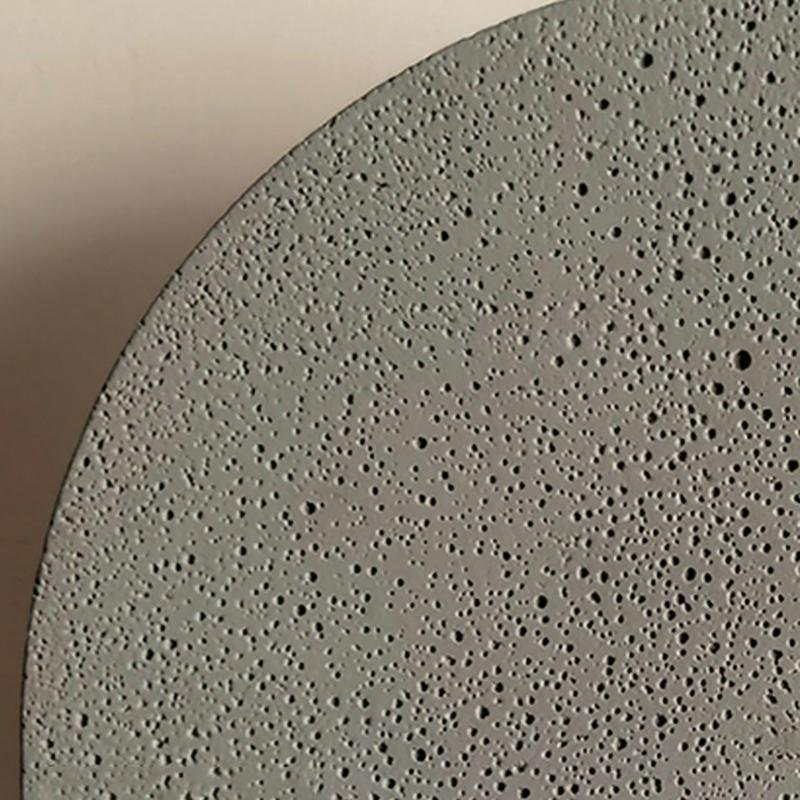 Round exterior wall lights with a textured design, providing warm illumination.