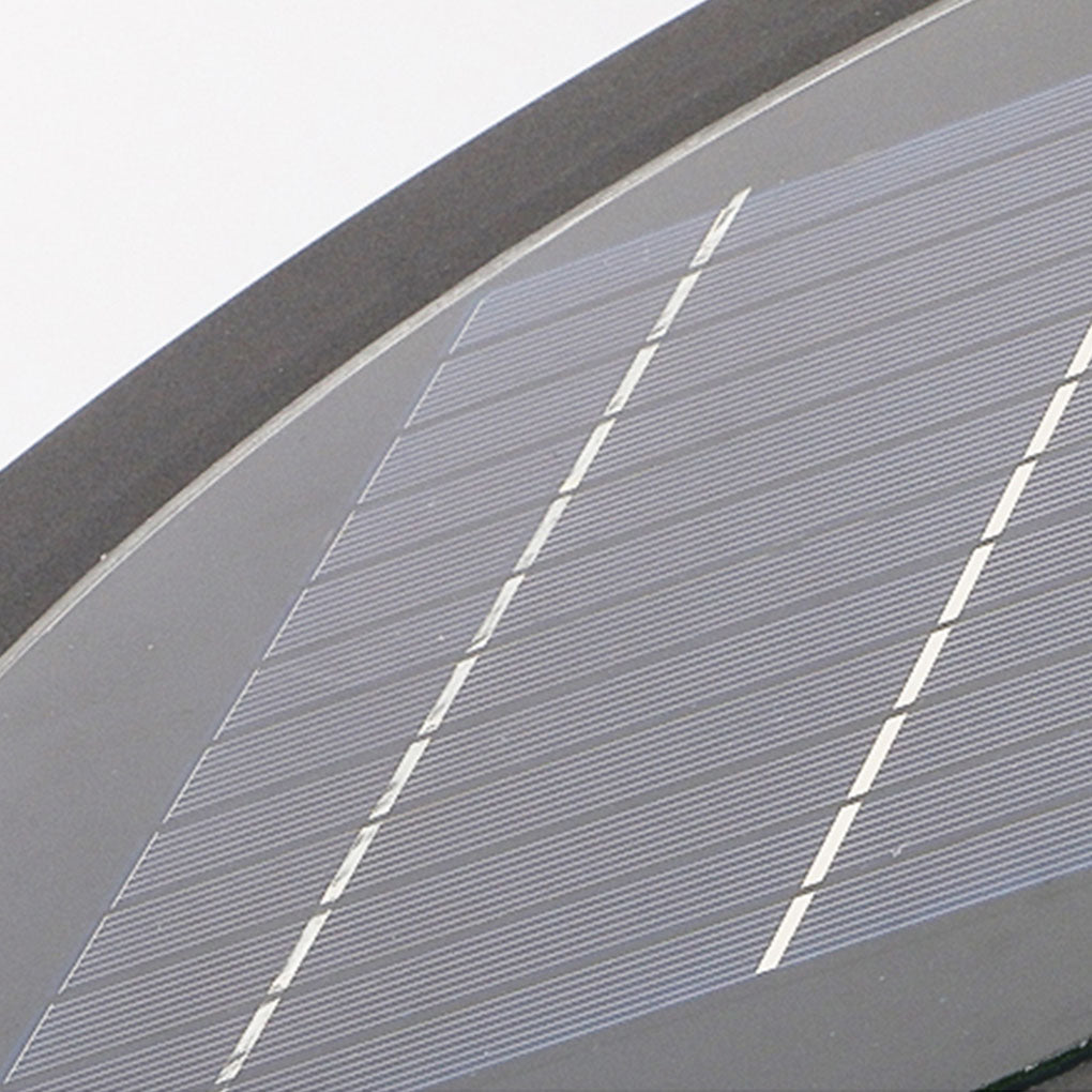 Close-up of round lawn light edge showing smooth metal finish