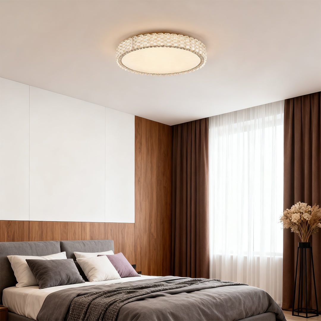 Round LED flush mount ceiling light fixtures installed in a modern bedroom interior.