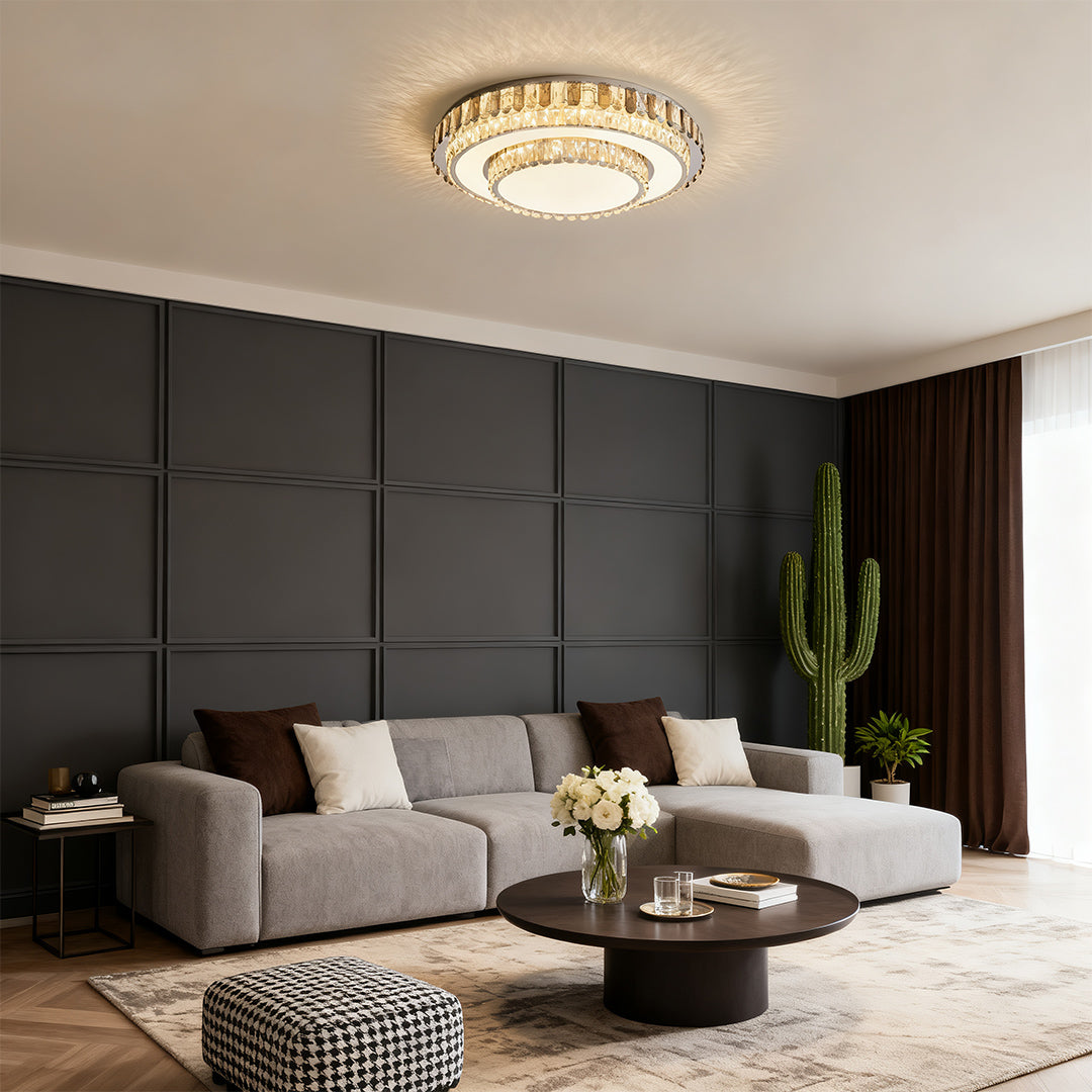 Round LED light fixtures flush mount with gold crystal rim in gray living room.