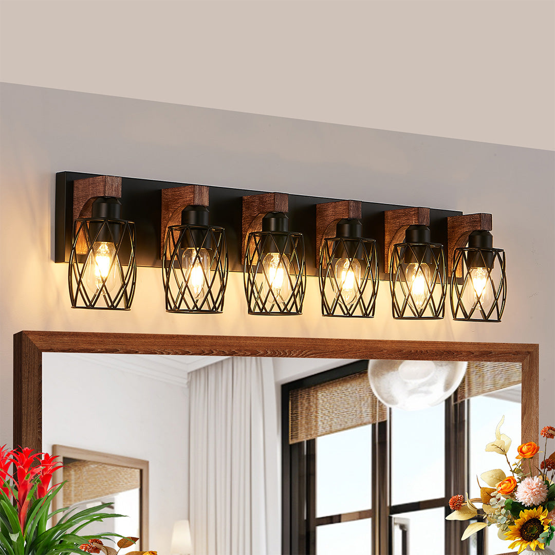 Black vanity bathroom light with three bulbs, installed above a round mirror for a stylish look.