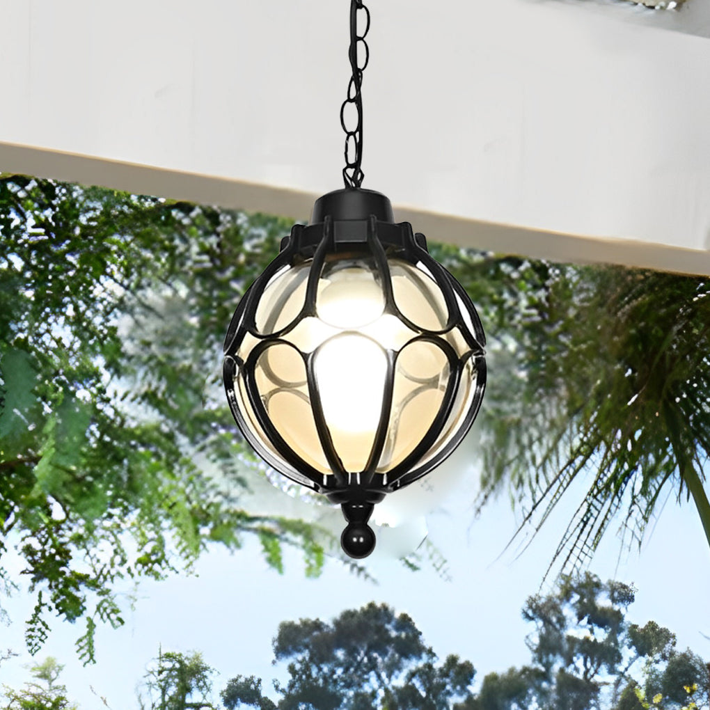 Round outdoor hanging lights providing ambient lighting in a garden patio setting.