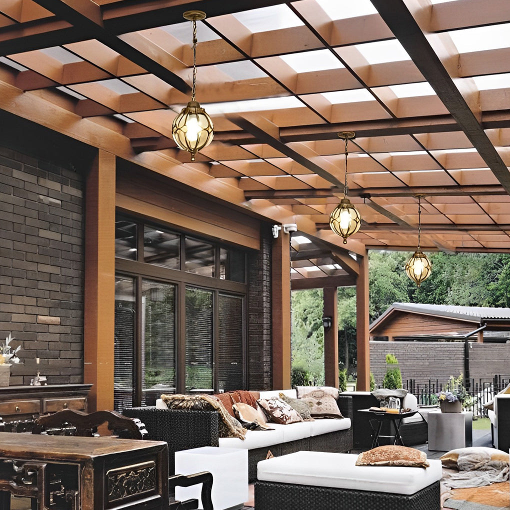 Round outdoor hanging lights with a close-up of their intricate glass pattern.