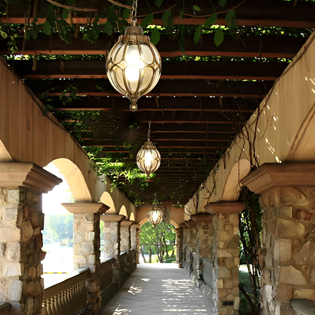 Round outdoor hanging lights with a detailed view of their glass and metal construction.