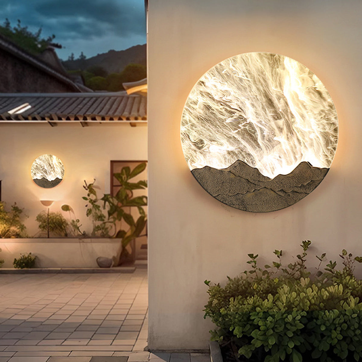 Round outdoor sconce illuminating a modern patio with a warm glow and stone wall.