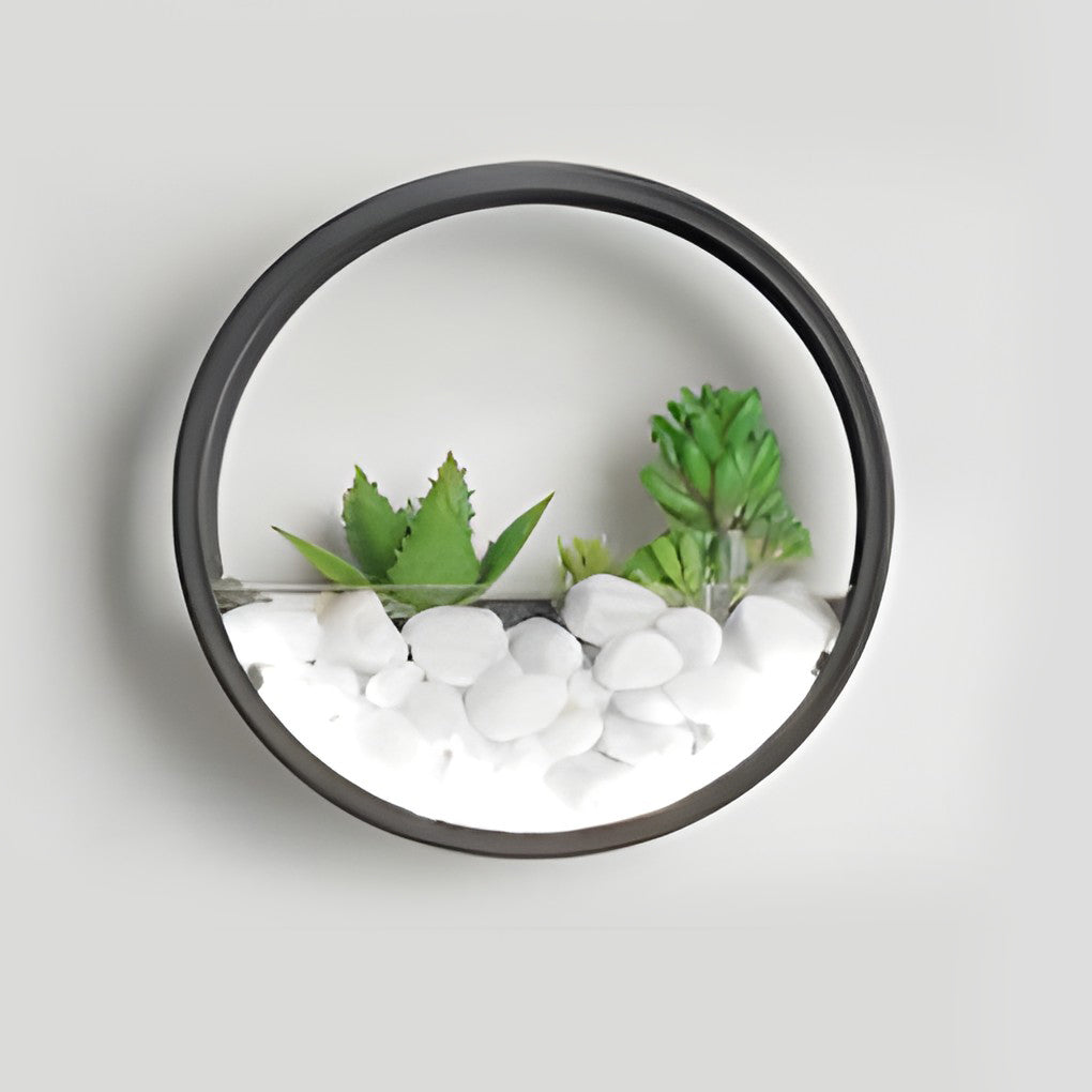 Round plant wall lamp with detailed view of its circular design and plants.