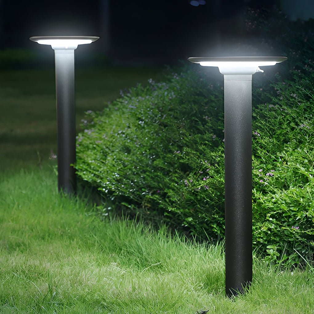 Outdoor bollards lighting providing soft illumination along a stylish garden path.