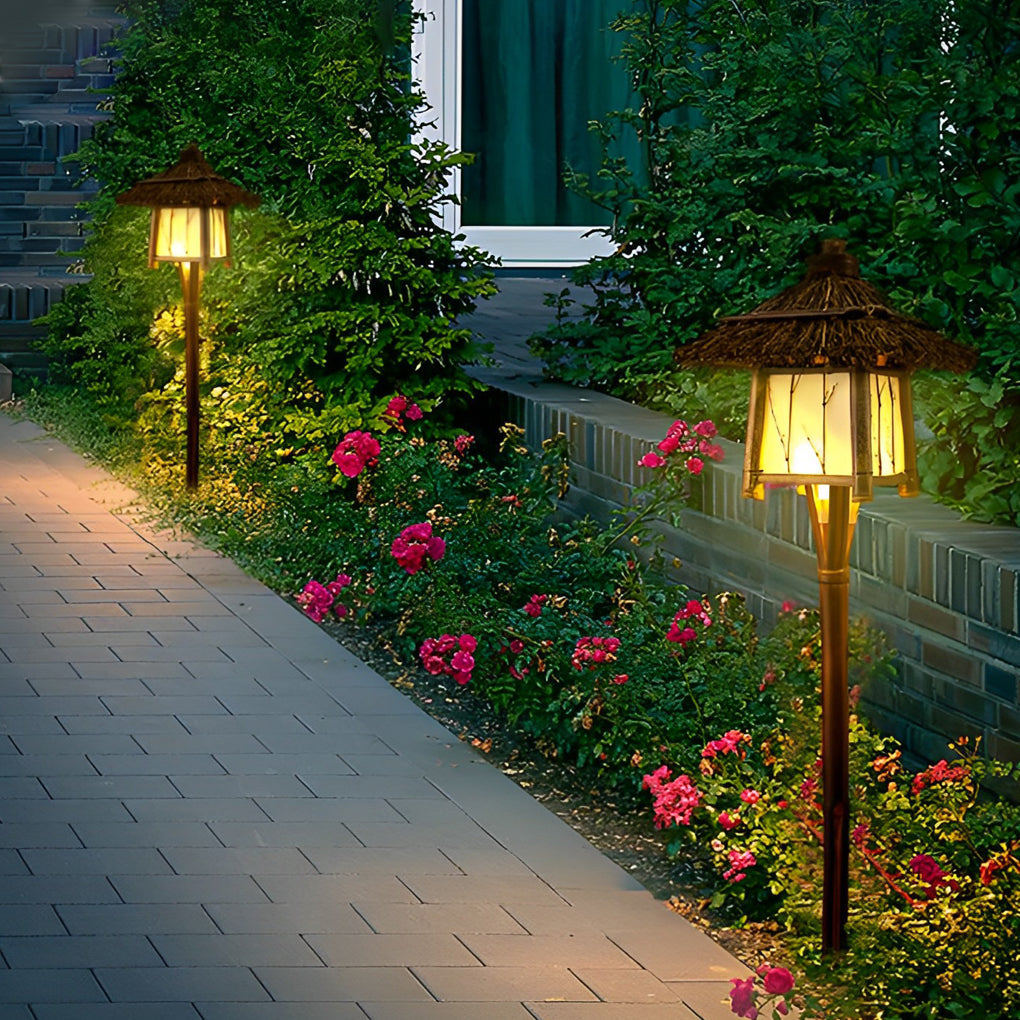 Rustic pendant light providing warm illumination beside a poolside walkway.