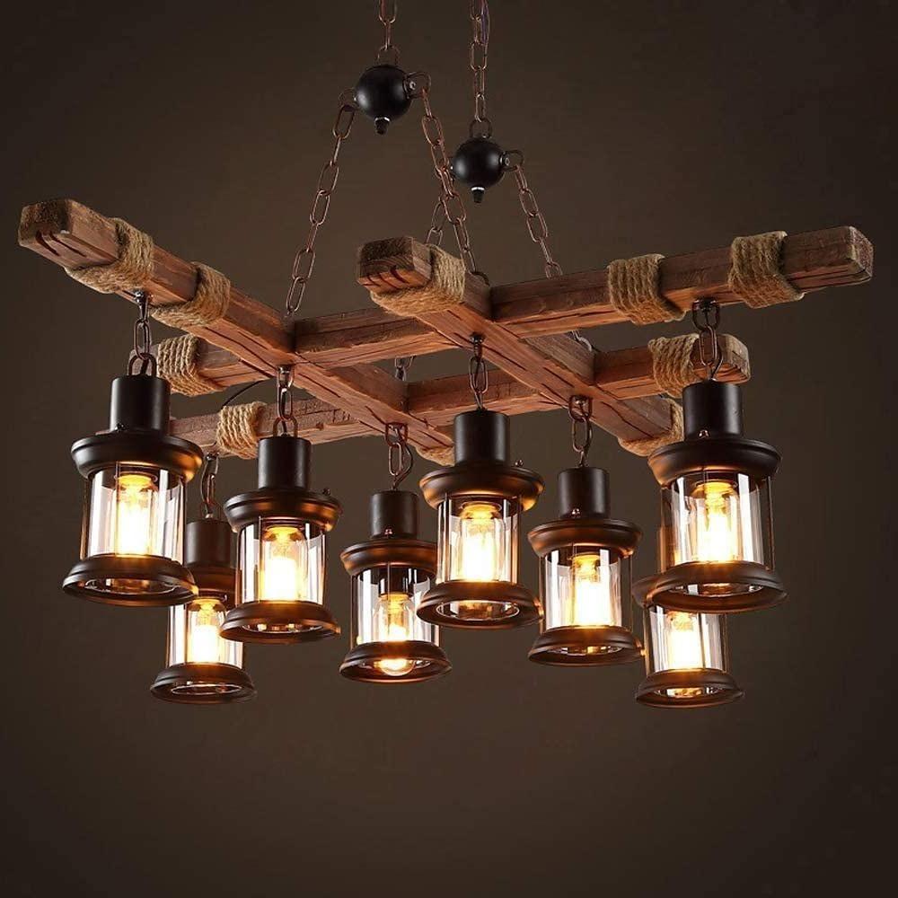 Rustic wood chandelier with evenly spaced lantern-style glass shades.