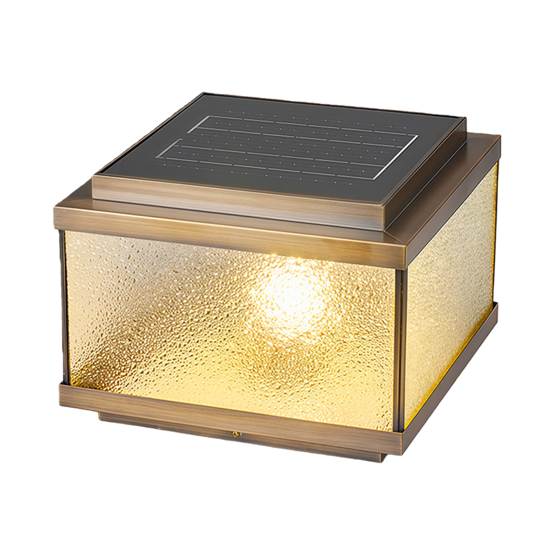 Modern garden pillar light featuring seeded glass design creating soft illumination for outdoor spaces.