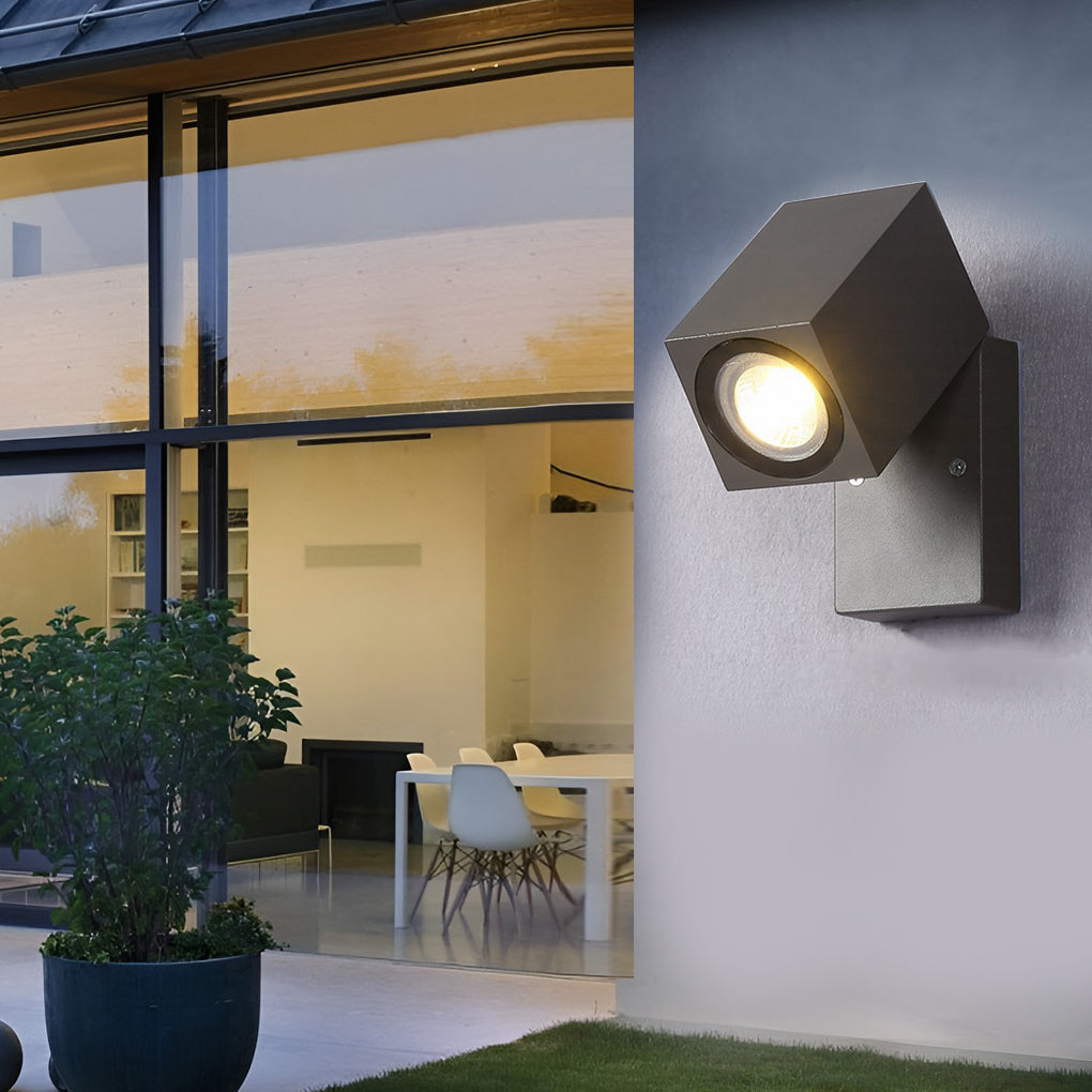 Black outdoor sensor wall lights installed near a patio, providing ambient lighting.
