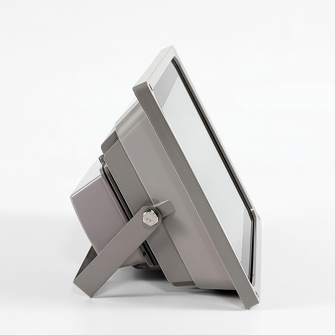 Side profile of a commercial-grade architectural flood lights unit, showcasing its slim profile and grey housing.