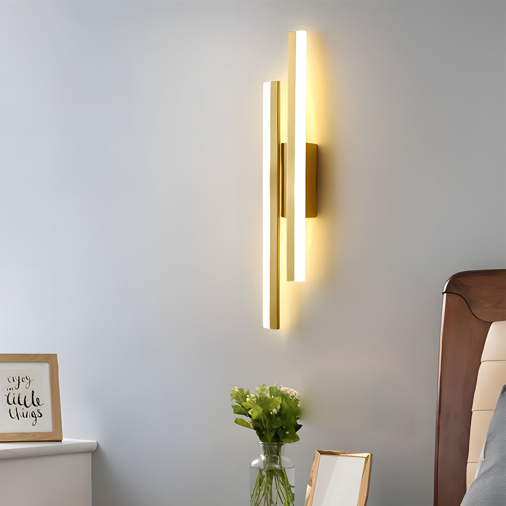 Luxurious side vanity light for bathroom with a gold finish, radiating warm light to enhance bathroom aesthetics.