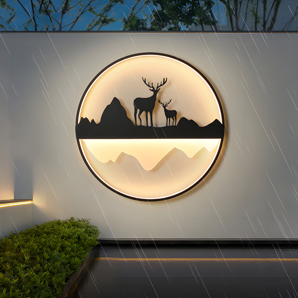 Silhouette wall light casting a soft glow on a modern building facade.
