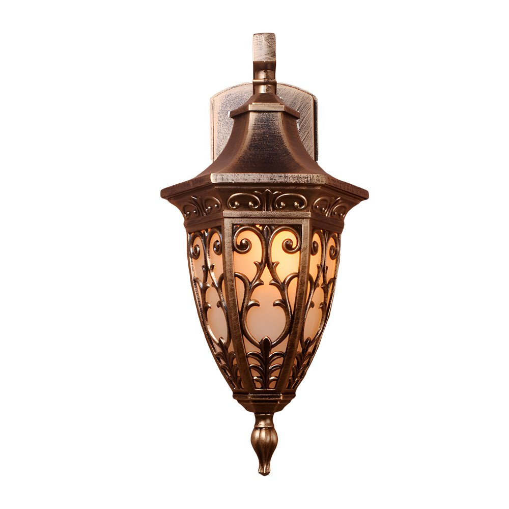 Single antique art deco wall sconce in bronze, showcasing detailed craftsmanship and warm light against a white backdrop.