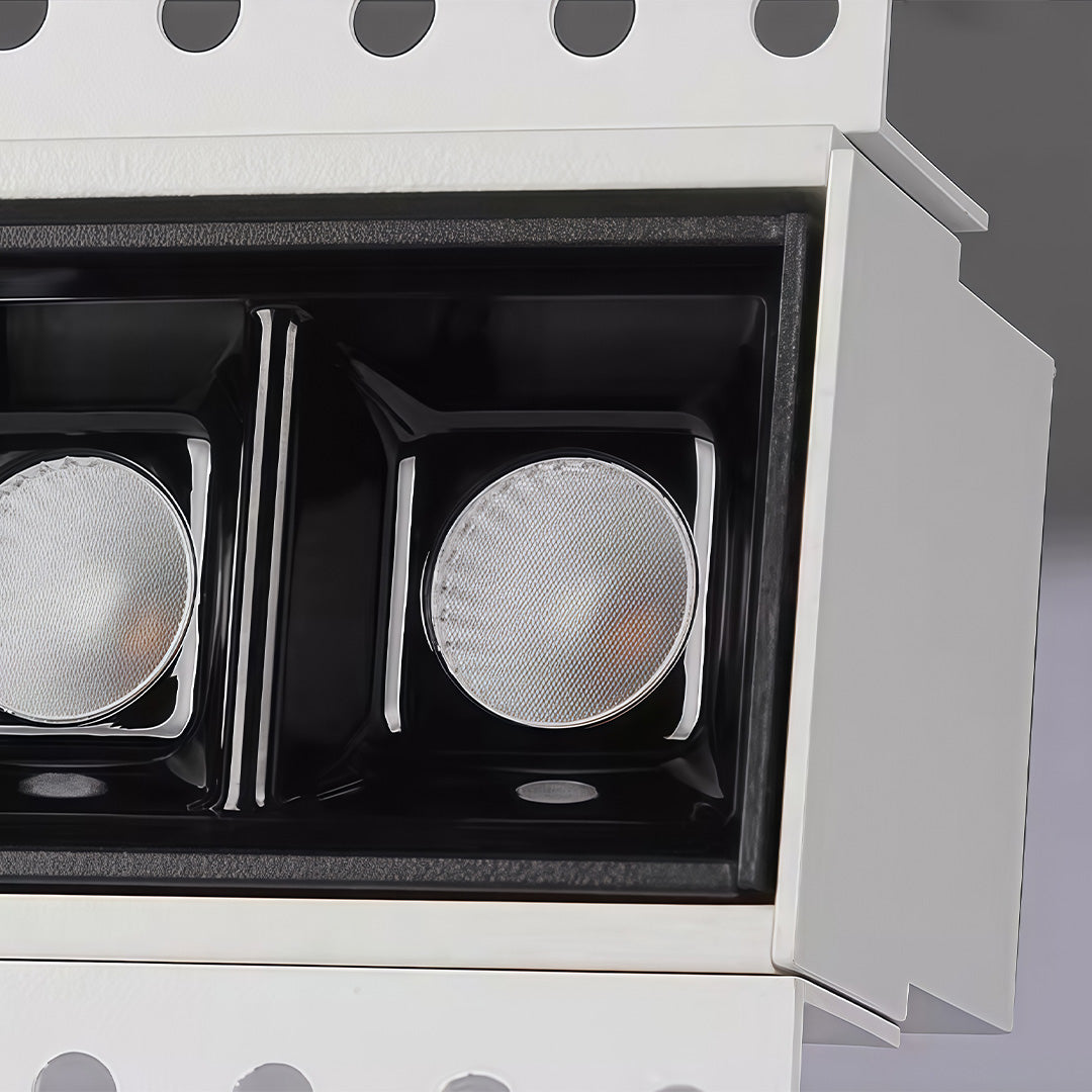 Single ice cube solar light product close-up on rocks.