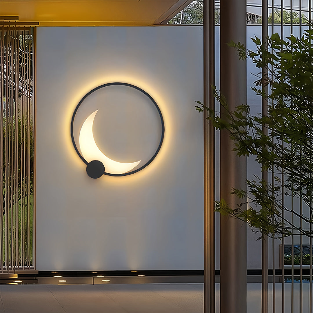 Single decorative outdoor wall light mounted on white exterior wall with warm ambient glow