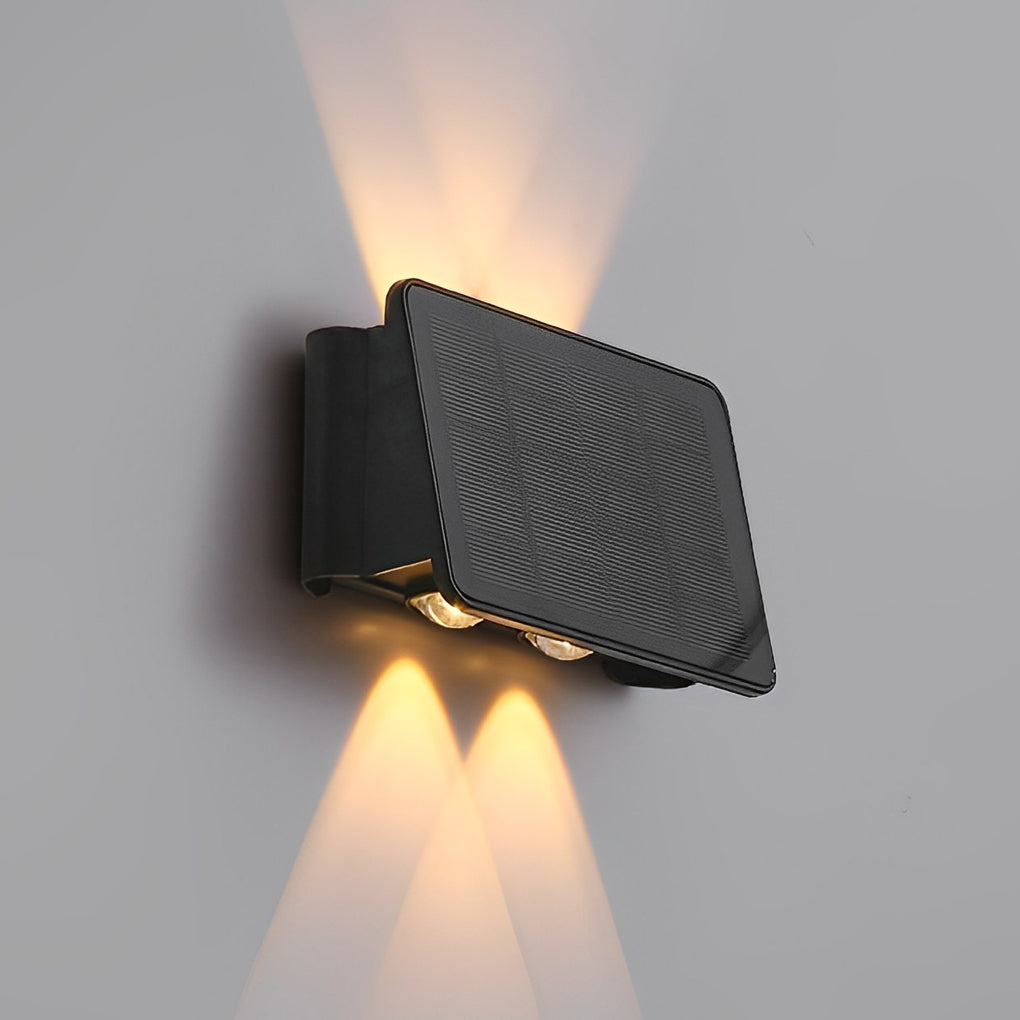 Wall sconce up and down light with sleek black design on white wall.