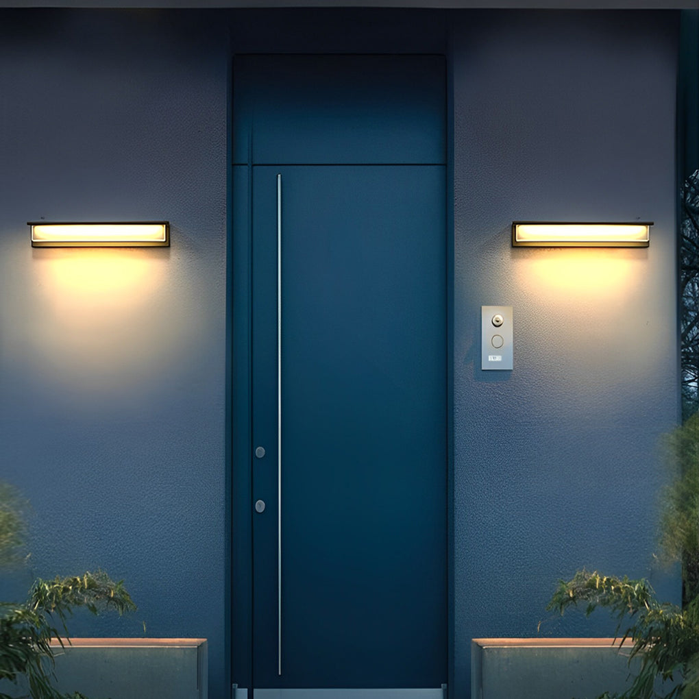 Front porch light fixtures with sleek design on exterior wall.